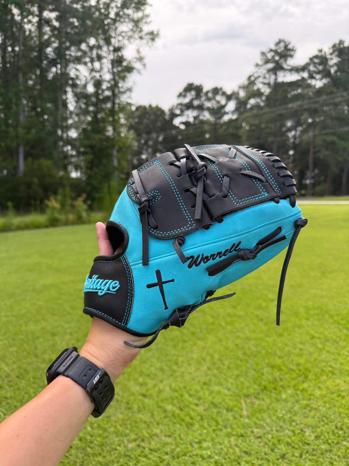 Teal and black Heritage glove with cross and 'Worrell' embroidery