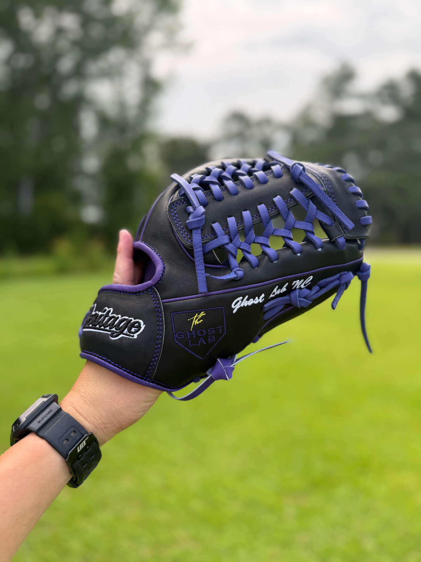 Black and purple Heritage glove with Ghost Lab NC embroidery